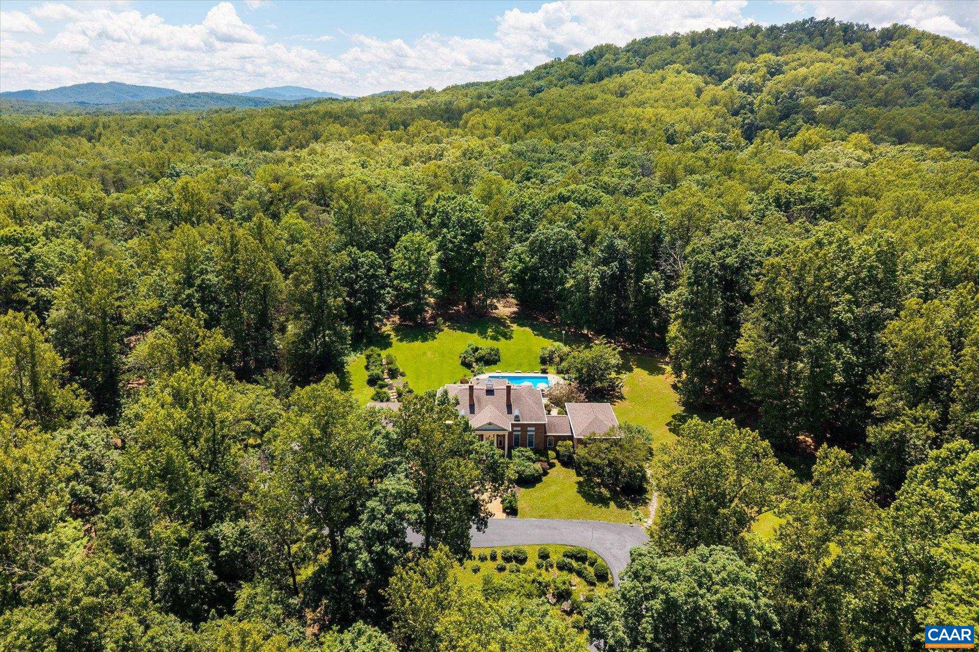 1462 Owensville Road Charlottesville, VA 22901 - Photo 54 of 56 an aerial view of residential houses with outdoor space and trees all around