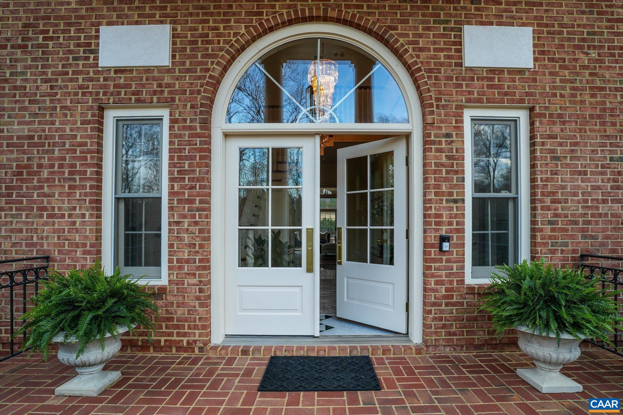 1462 Owensville Road Charlottesville, VA 22901 - Photo 56 of 56 a view of a brick house with a door