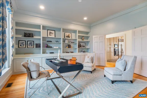 a kitchen with stainless steel appliances kitchen island granite countertop a sink and cabinets