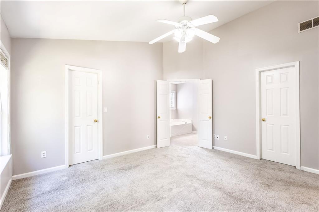1545 Anna Ruby Lane Kennesaw, GA 30152 - Photo 20 of 45 a view of a big room with chandelier fan and closet