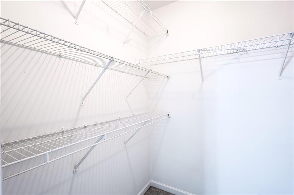 1545 Anna Ruby Lane Kennesaw, GA 30152 - Photo 25 of 45 a view of a room with racks on the wall