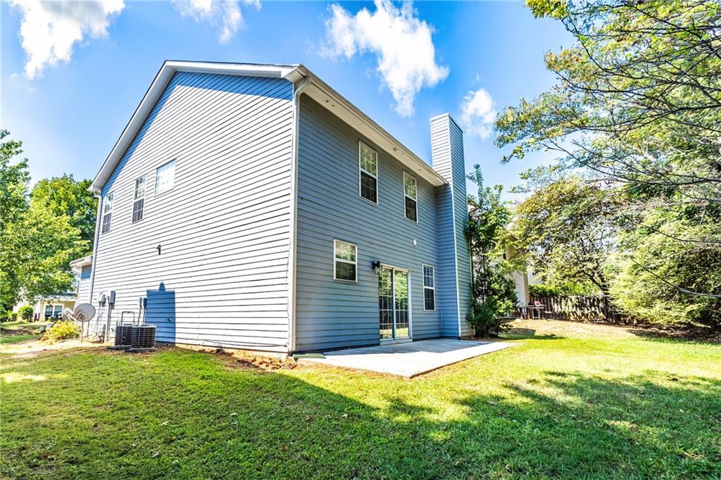 1545 Anna Ruby Lane Kennesaw, GA 30152 - Photo 39 of 45 a backyard of a house with table and chairs