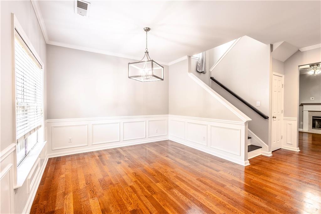 1545 Anna Ruby Lane Kennesaw, GA 30152 - Photo 4 of 45 a view of empty room with wooden floor and fan