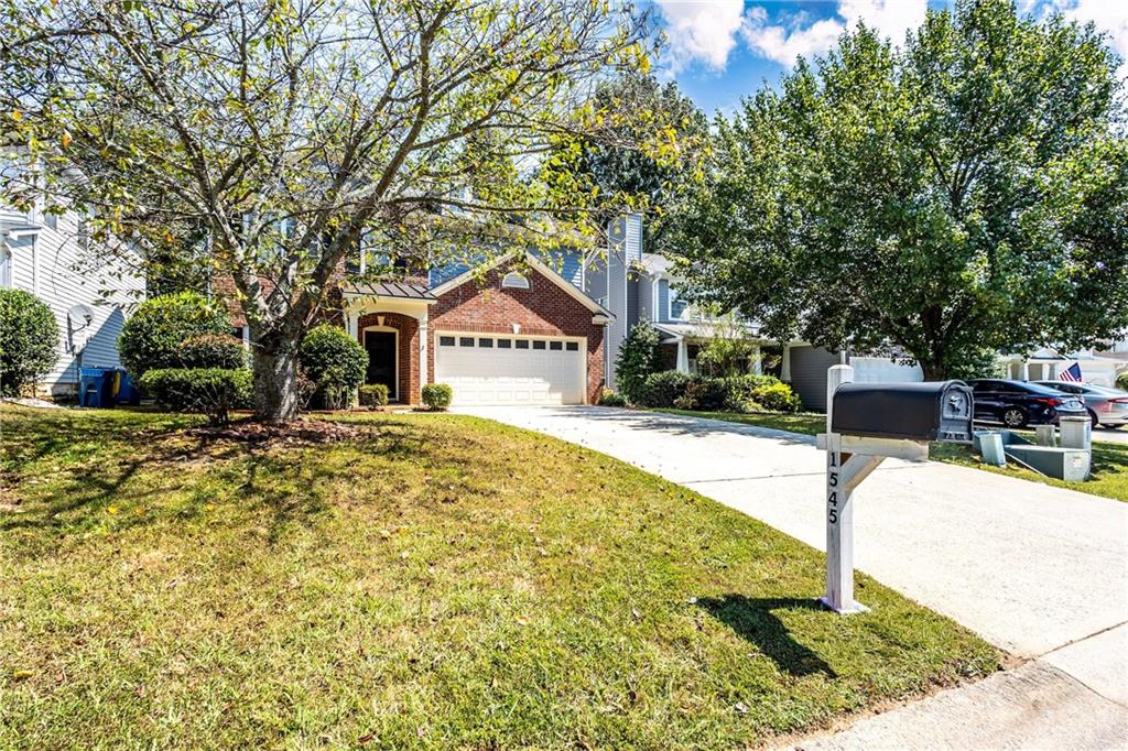 1545 Anna Ruby Lane Kennesaw, GA 30152 - Photo 43 of 45 a house with trees in front of it
