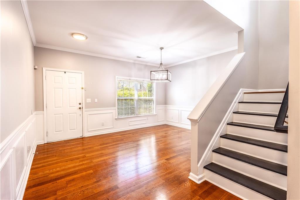 1545 Anna Ruby Lane Kennesaw, GA 30152 - Photo 5 of 45 wooden floor in an empty room with a window