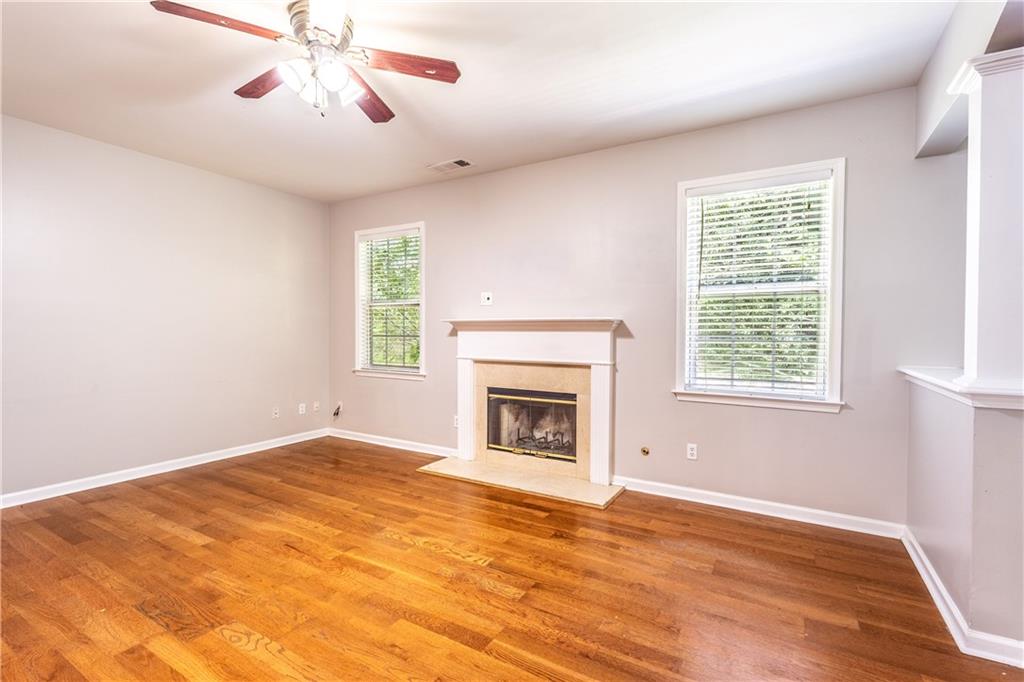 1545 Anna Ruby Lane Kennesaw, GA 30152 - Photo 6 of 45 a view of an empty room with window and a fireplace