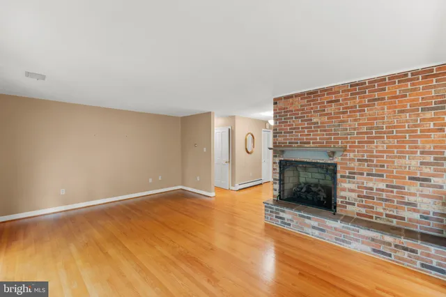 a view of an empty room with glass door