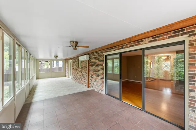 a very nice looking room with a chair and a fireplace