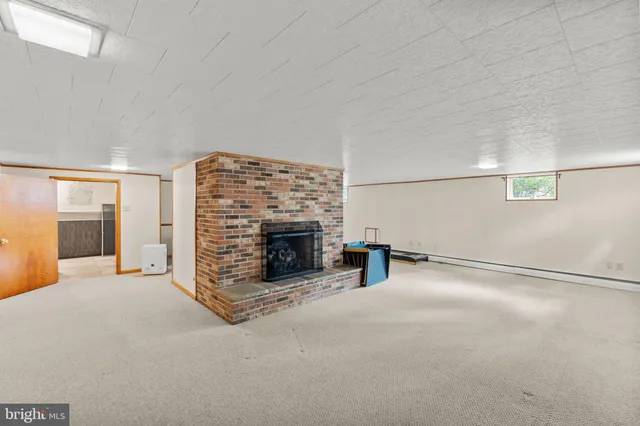 a view of livingroom with stairs and furniture