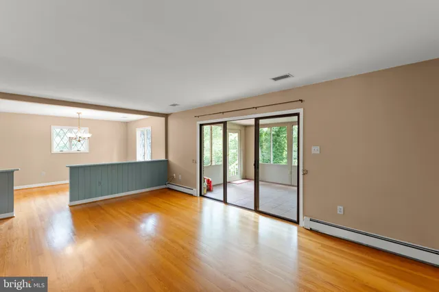 a view of empty room with a fireplace