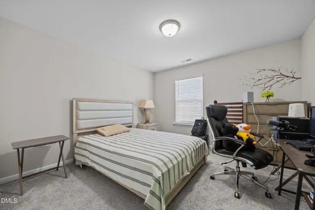 a bathroom with a sink toilet and mirror