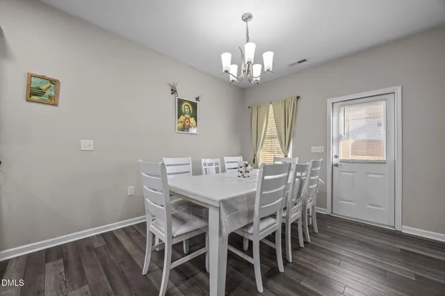 a bathroom with double vanity sinks and a bathtub