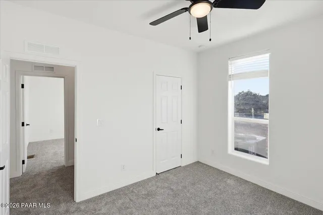 a view of an empty room and window