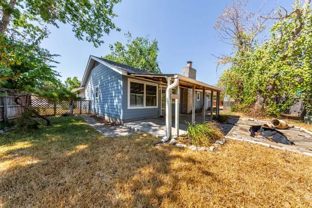 a view of a room with gym equipment and floor to ceiling window