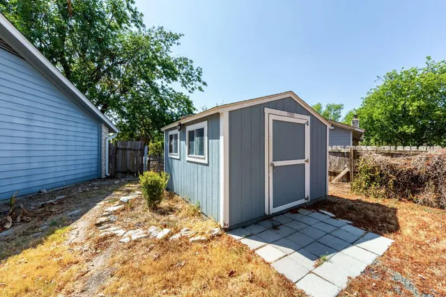 a house with trees in the background