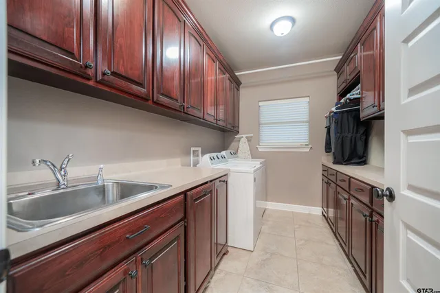 a kitchen with stainless steel appliances granite countertop a sink and dishwasher a stove top oven with wooden floor