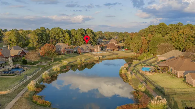 a view of a house with a yard and sitting area