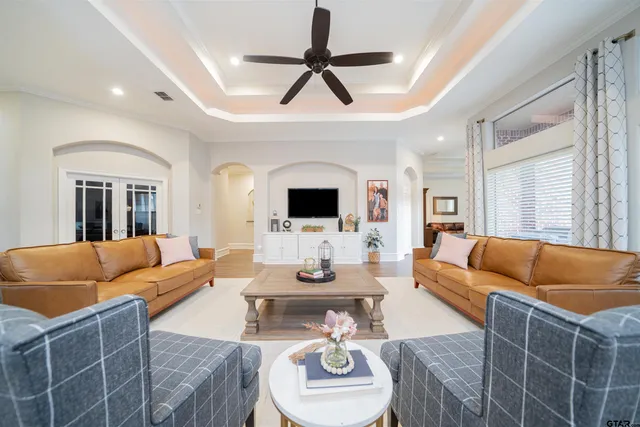 a living room with furniture a rug and a fireplace