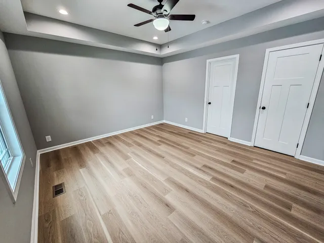 a view of room with window and ceiling fan