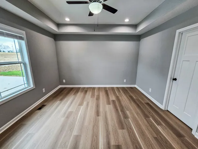a view of room with ceiling fan