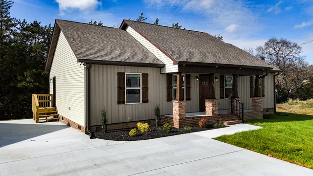 a front view of a house with garden