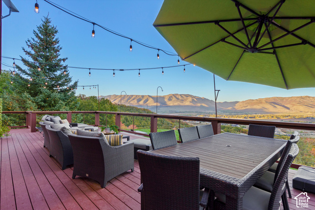 5878 Snowbasin Road Huntsville, UT 84317 - Photo 49 of 90 Expansive outdoor deck featuring composite decking, string lights, and a railing system