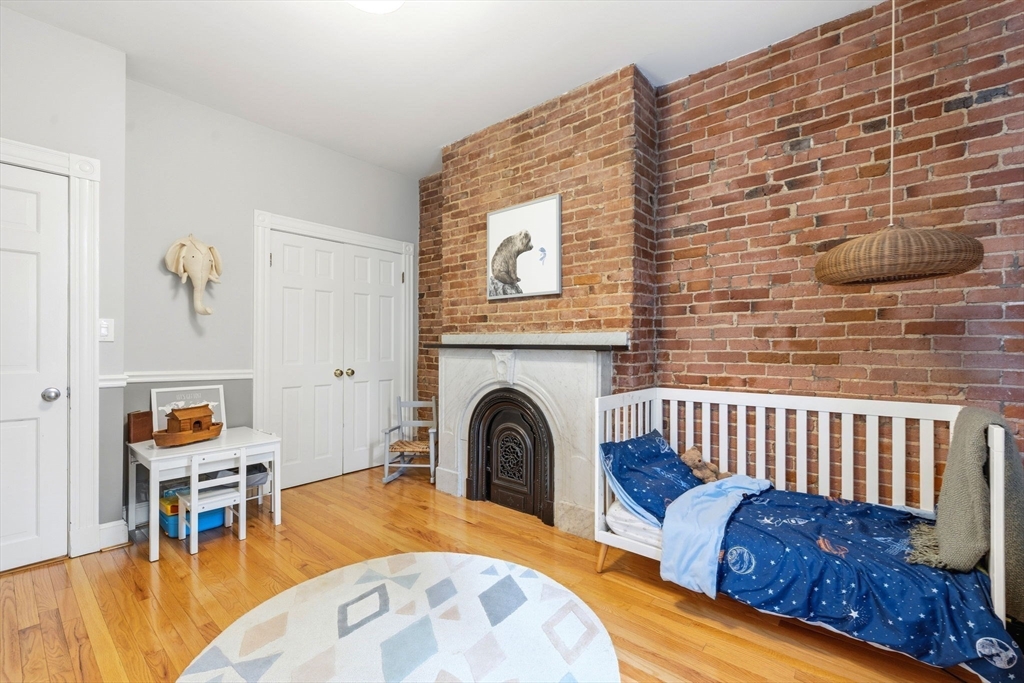35 High Street, Unit 1 Boston, MA 02129 - Photo 12 of 33 a view of a livingroom with furniture and a fireplace