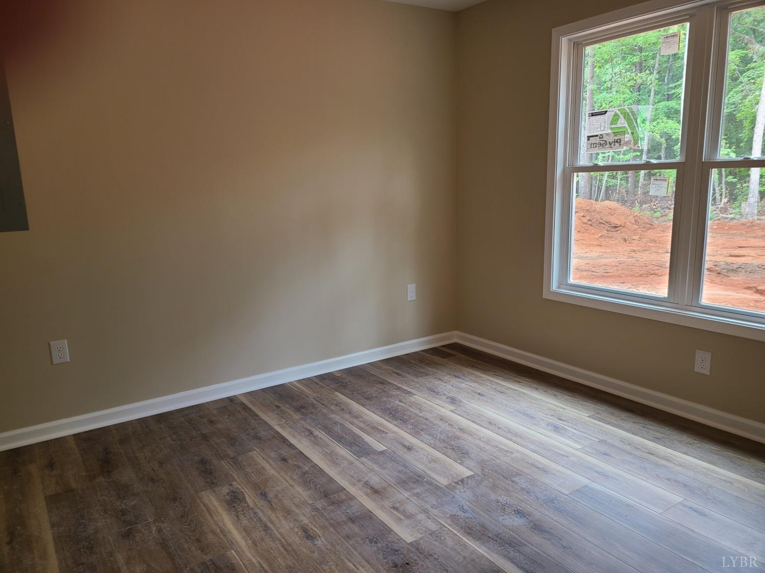 2375 Stonewall Road Concord, VA 24538 - Photo 11 of 13 a view of an empty room with wooden floor and a window