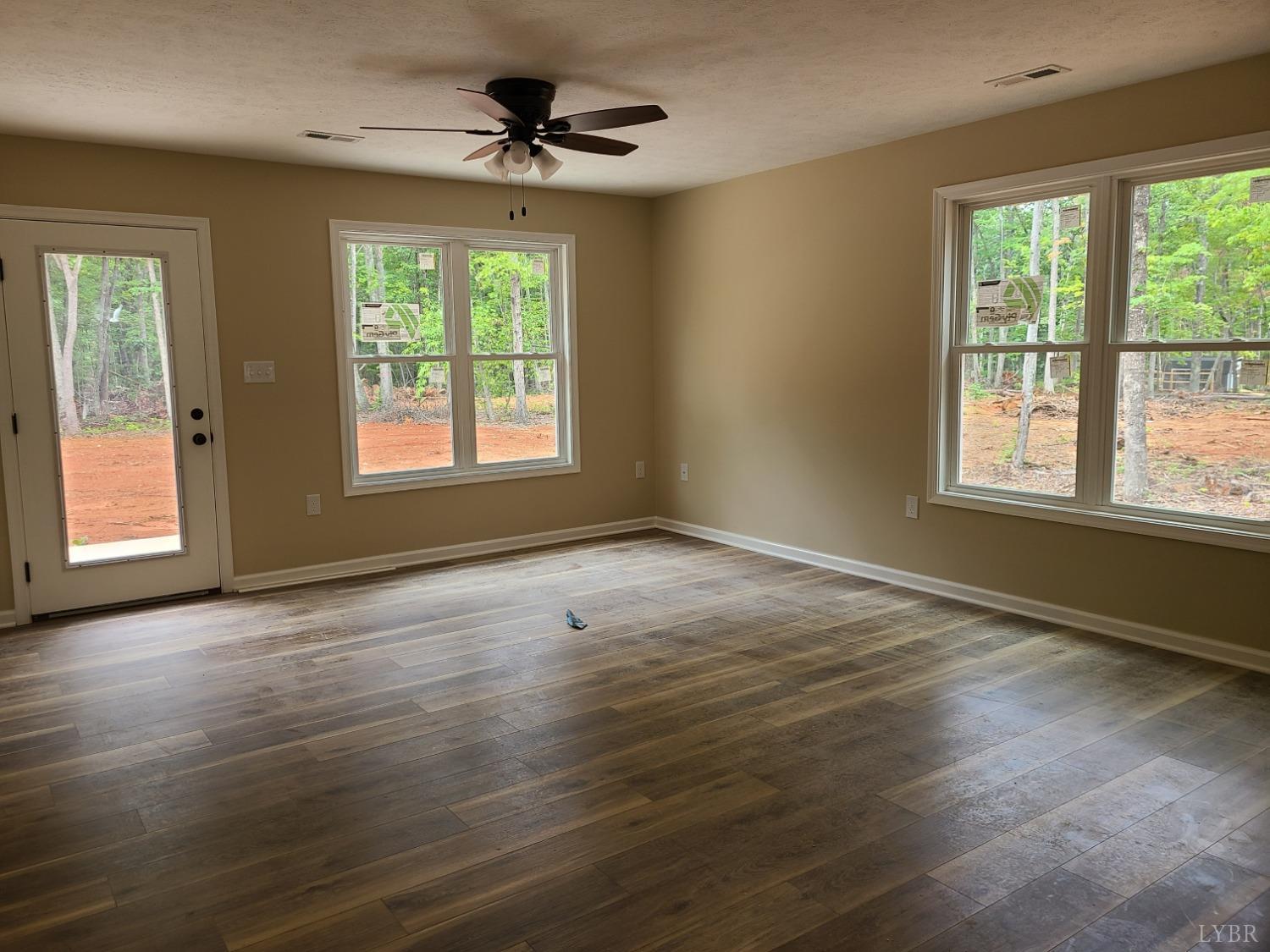 2375 Stonewall Road Concord, VA 24538 - Photo 6 of 13 a view of an empty room with wooden floor and a window