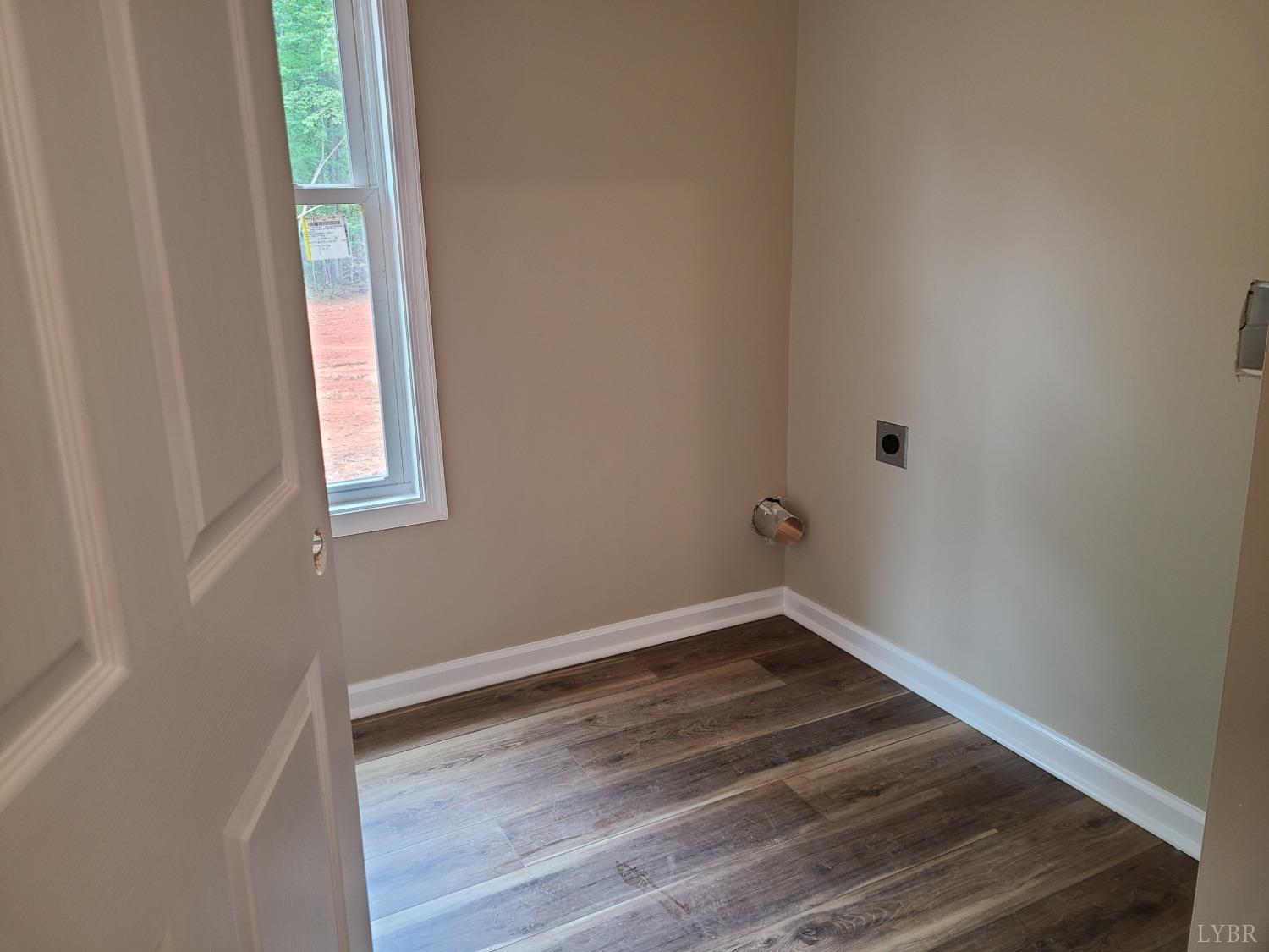 2375 Stonewall Road Concord, VA 24538 - Photo 9 of 13 an empty room with wooden floor and windows