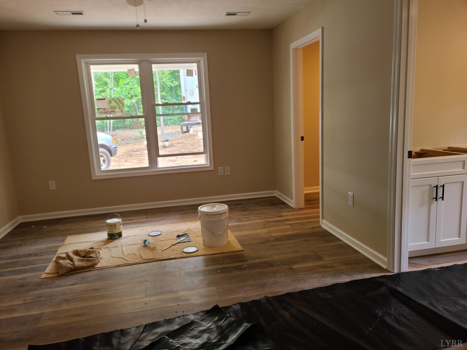 2375 Stonewall Road Concord, VA 24538 - Photo 10 of 13 a room with wooden floor and cabinets