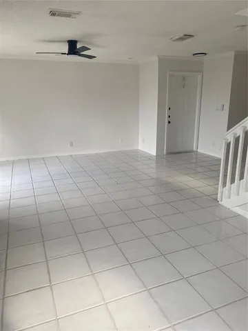 a view of an empty room and entryway