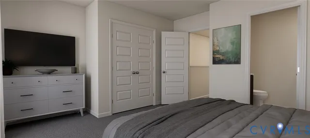 a bedroom with a bed and a flat tv screen in it