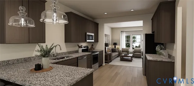 a kitchen with a sink a counter space and living room view
