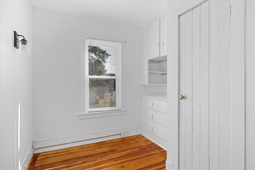 278 Plumtree Road Springfield, MA 01118 - Photo 20 of 26 a view of a room with wooden floor and windows