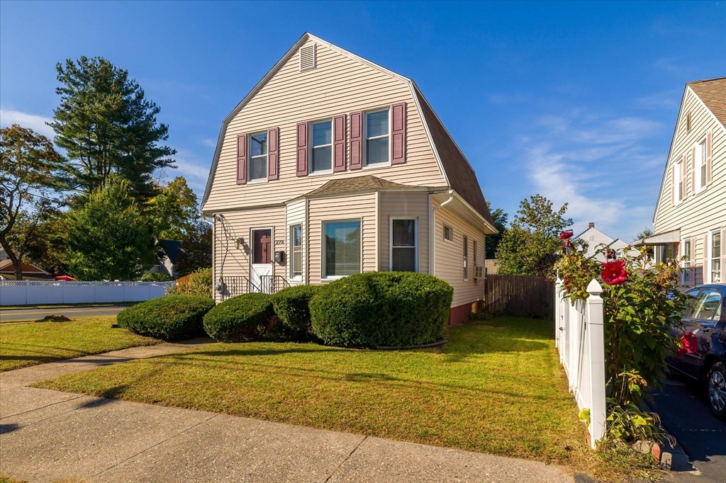 278 Plumtree Road Springfield, MA 01118 - Photo 3 of 26 a front view of a house with a garden