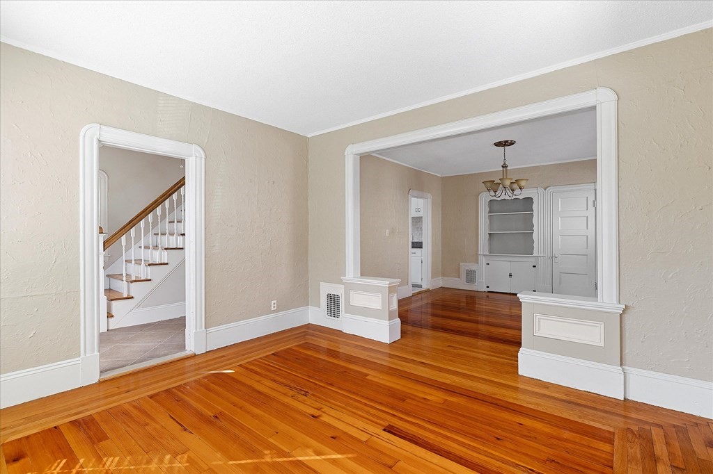 278 Plumtree Road Springfield, MA 01118 - Photo 9 of 26 a bedroom with a bed and dresser with mirror