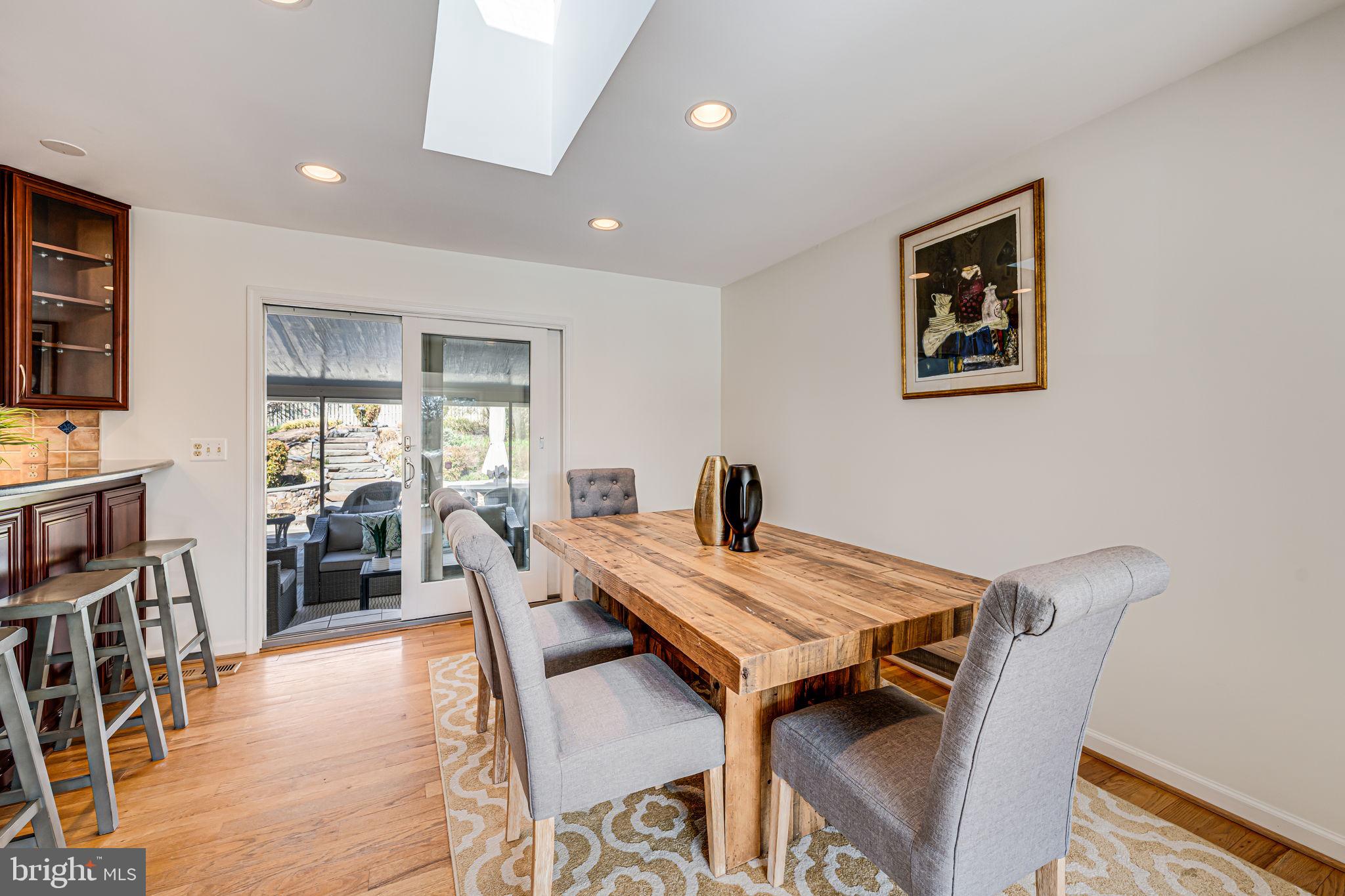 1831 Quartet Circle Vienna, VA 22182 - Photo 13 of 60 a view of a dining room with furniture window and wooden floor