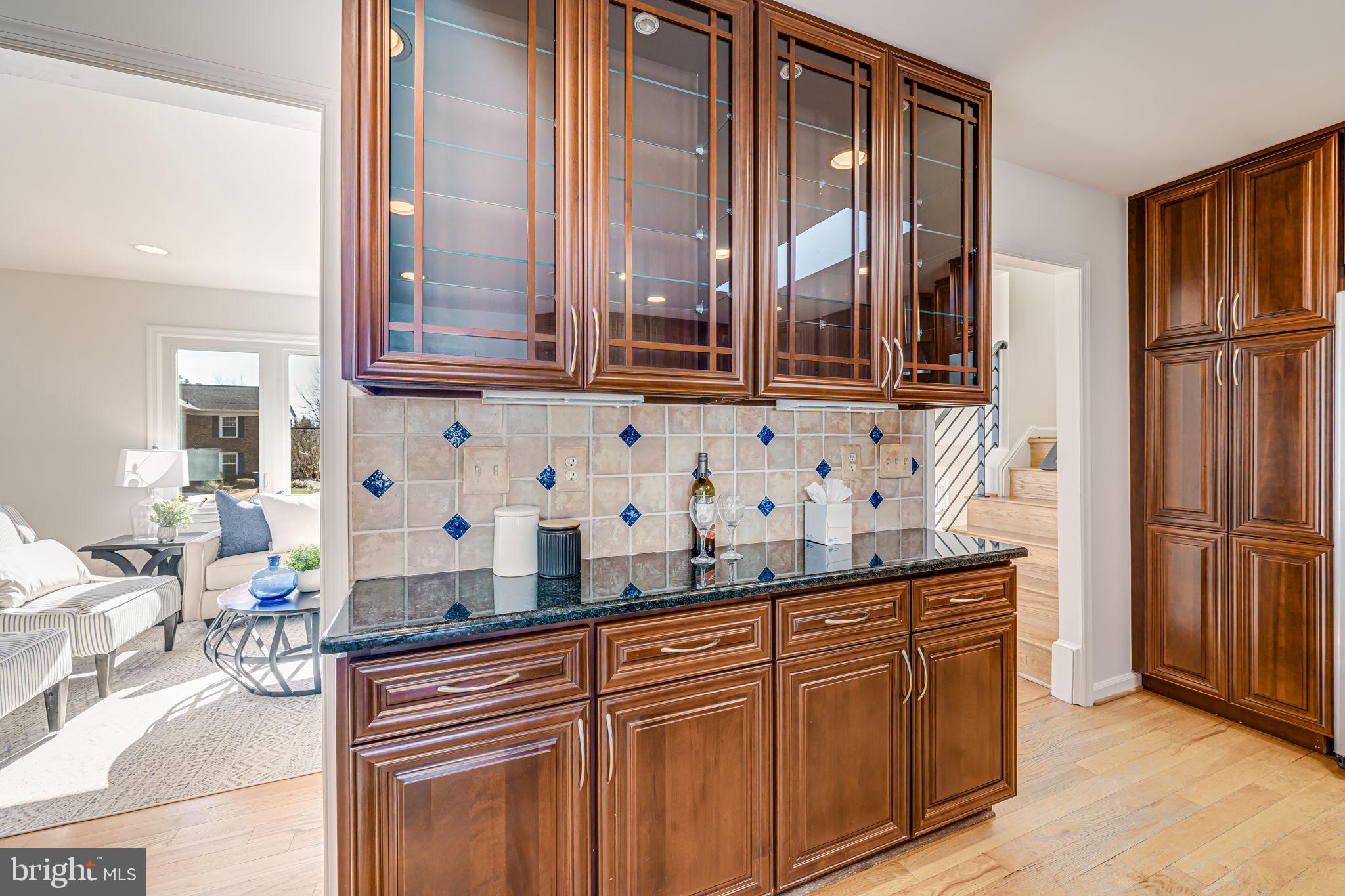1831 Quartet Circle Vienna, VA 22182 - Photo 14 of 60 a kitchen with stainless steel appliances granite countertop a refrigerator and a sink