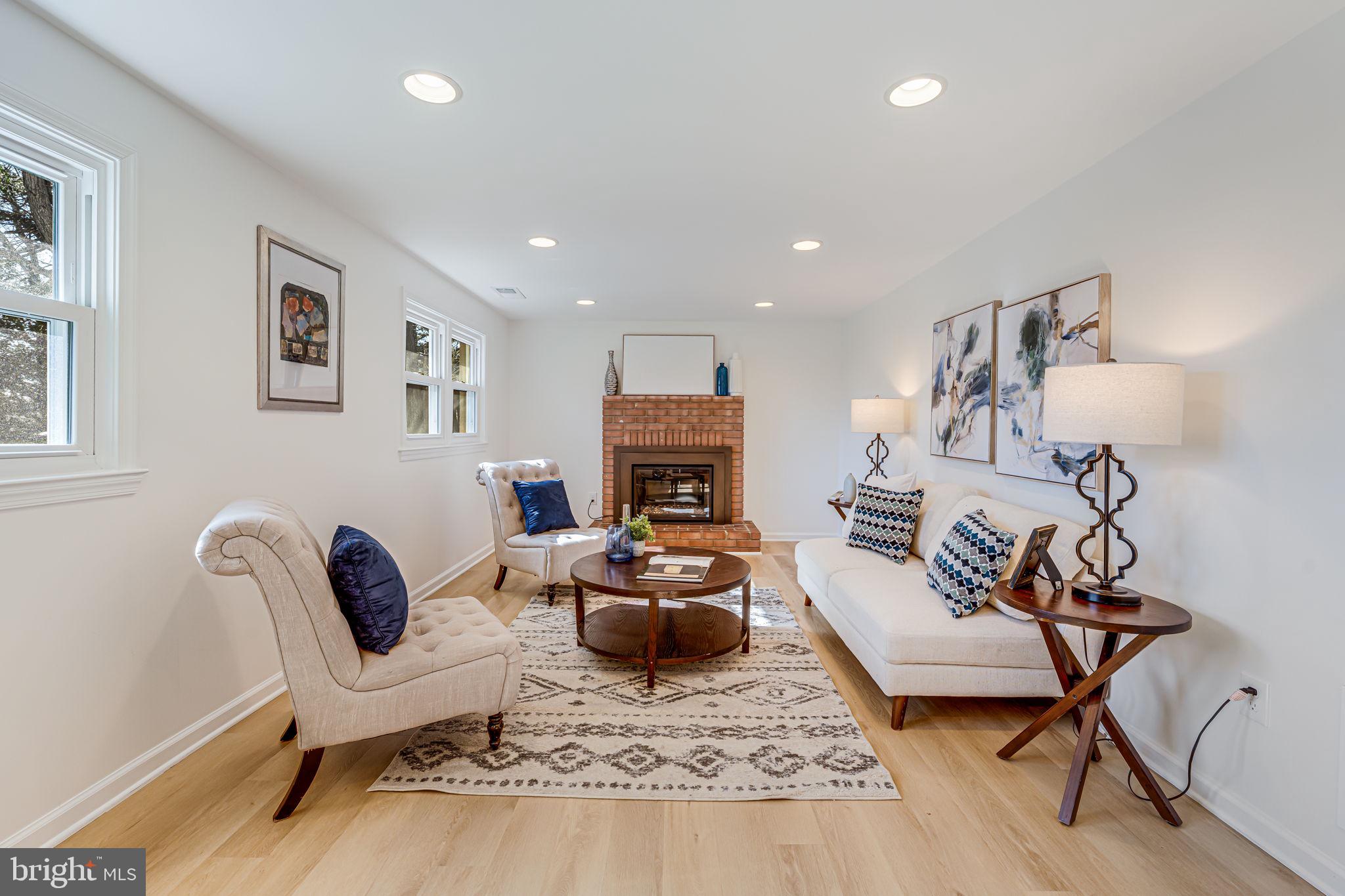 1831 Quartet Circle Vienna, VA 22182 - Photo 22 of 60 a living room with furniture or couch and a fireplace