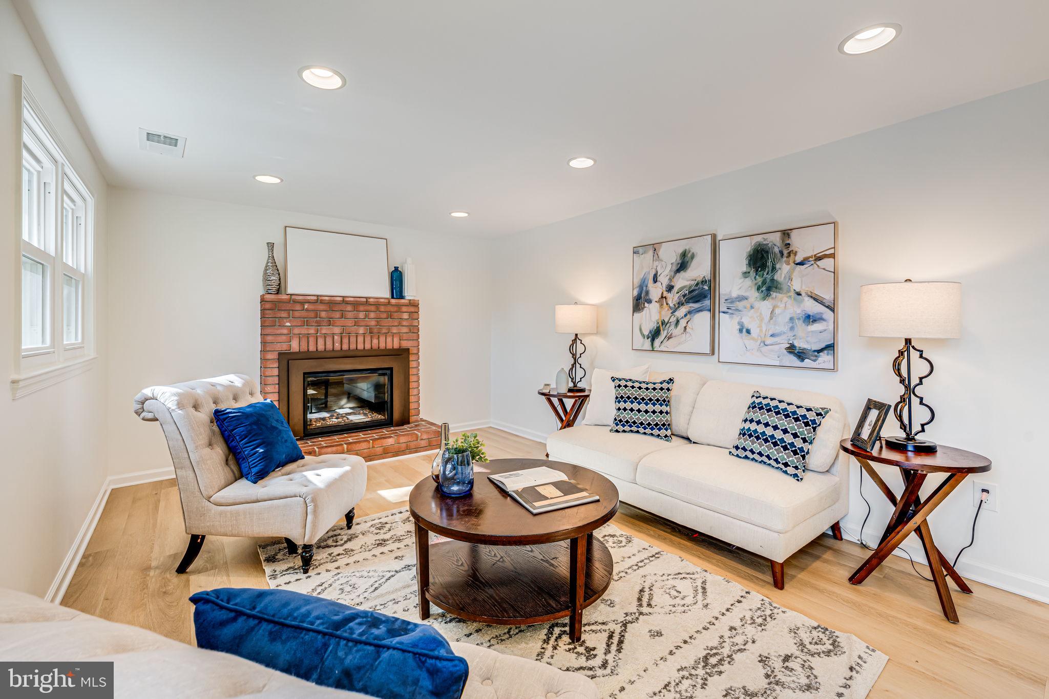 1831 Quartet Circle Vienna, VA 22182 - Photo 24 of 60 a living room with furniture and a fireplace