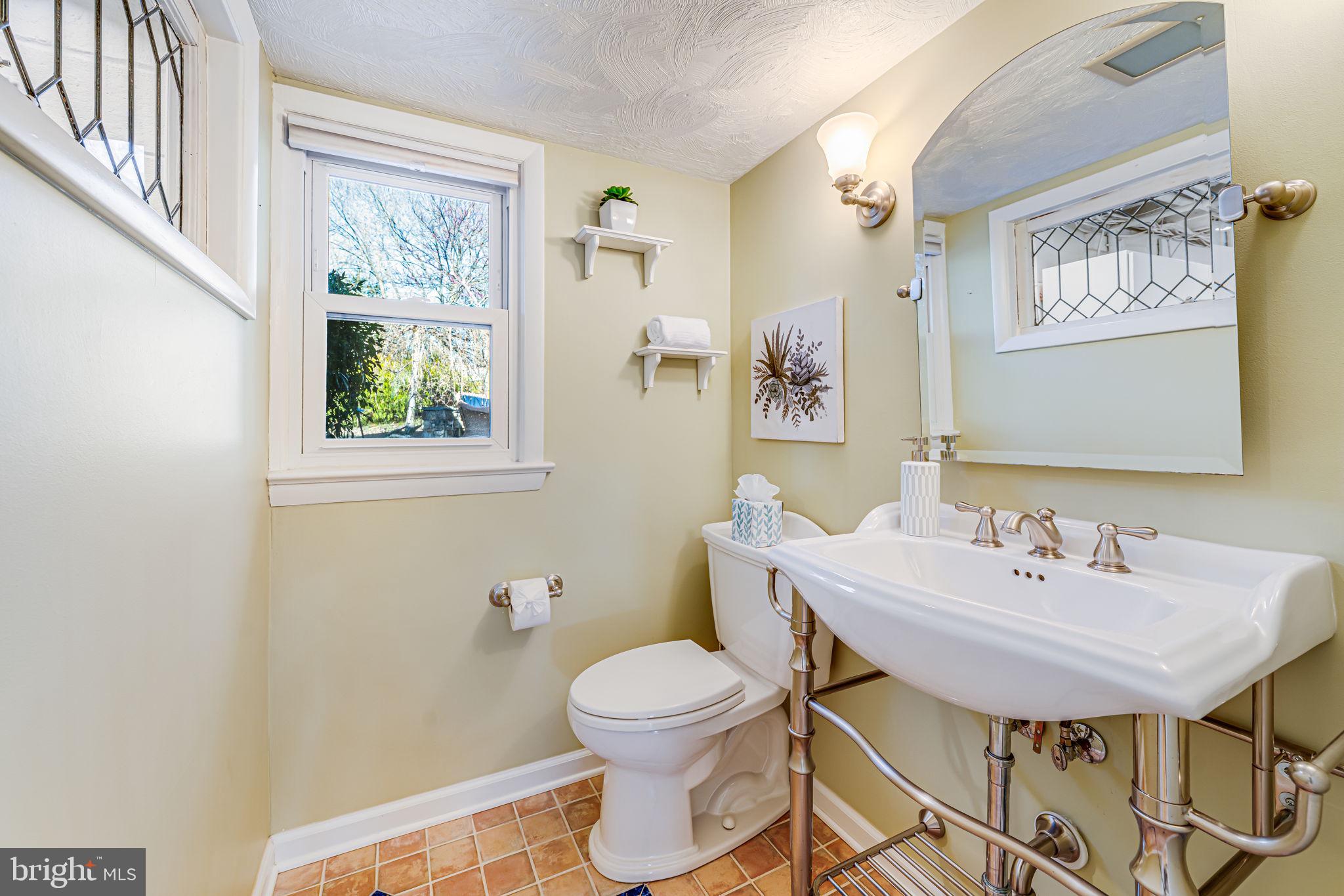 1831 Quartet Circle Vienna, VA 22182 - Photo 26 of 60 a bathroom with a toilet a sink and a mirror