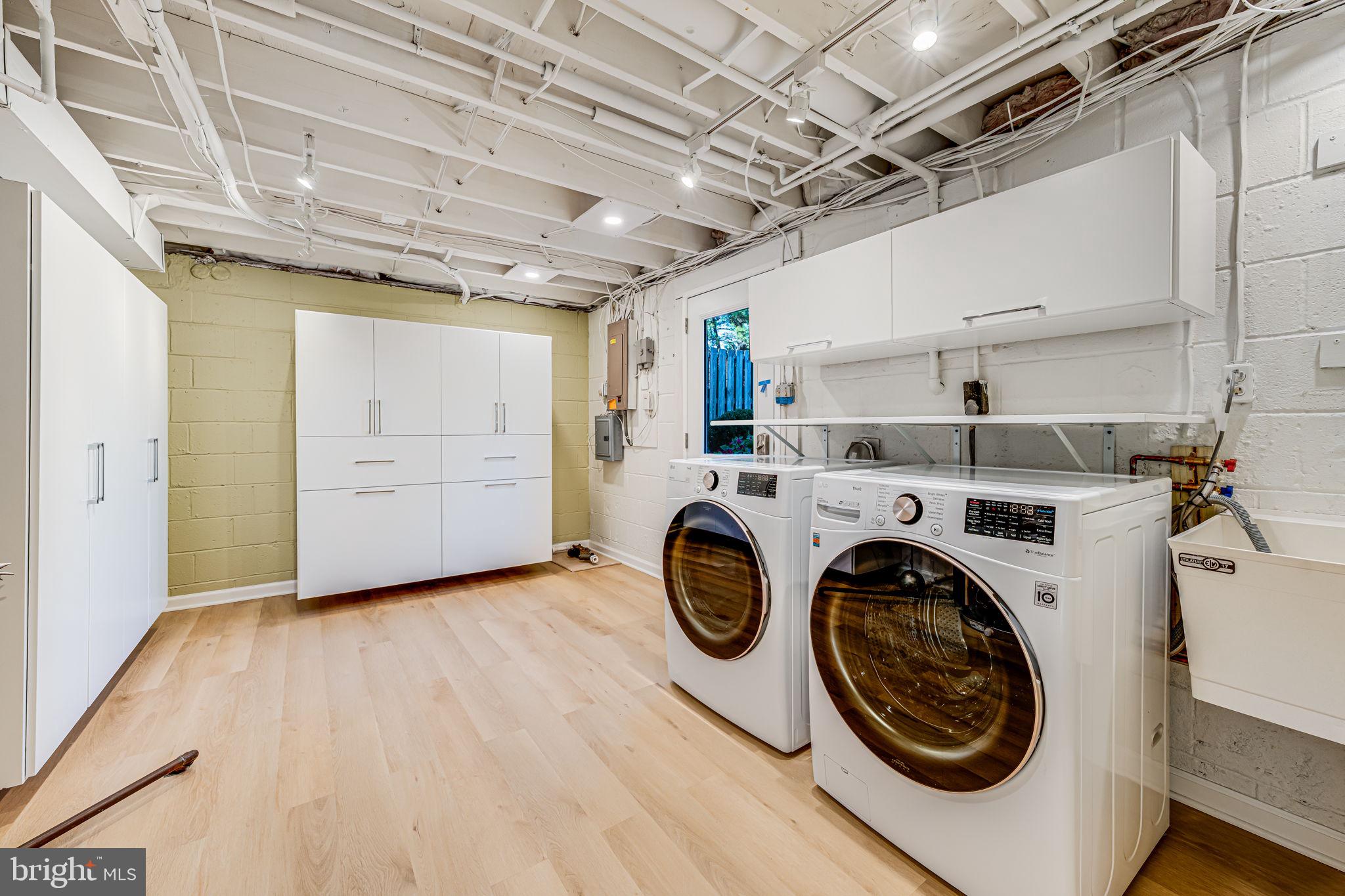 1831 Quartet Circle Vienna, VA 22182 - Photo 27 of 60 a view of a storage & utility room with washer and dryer