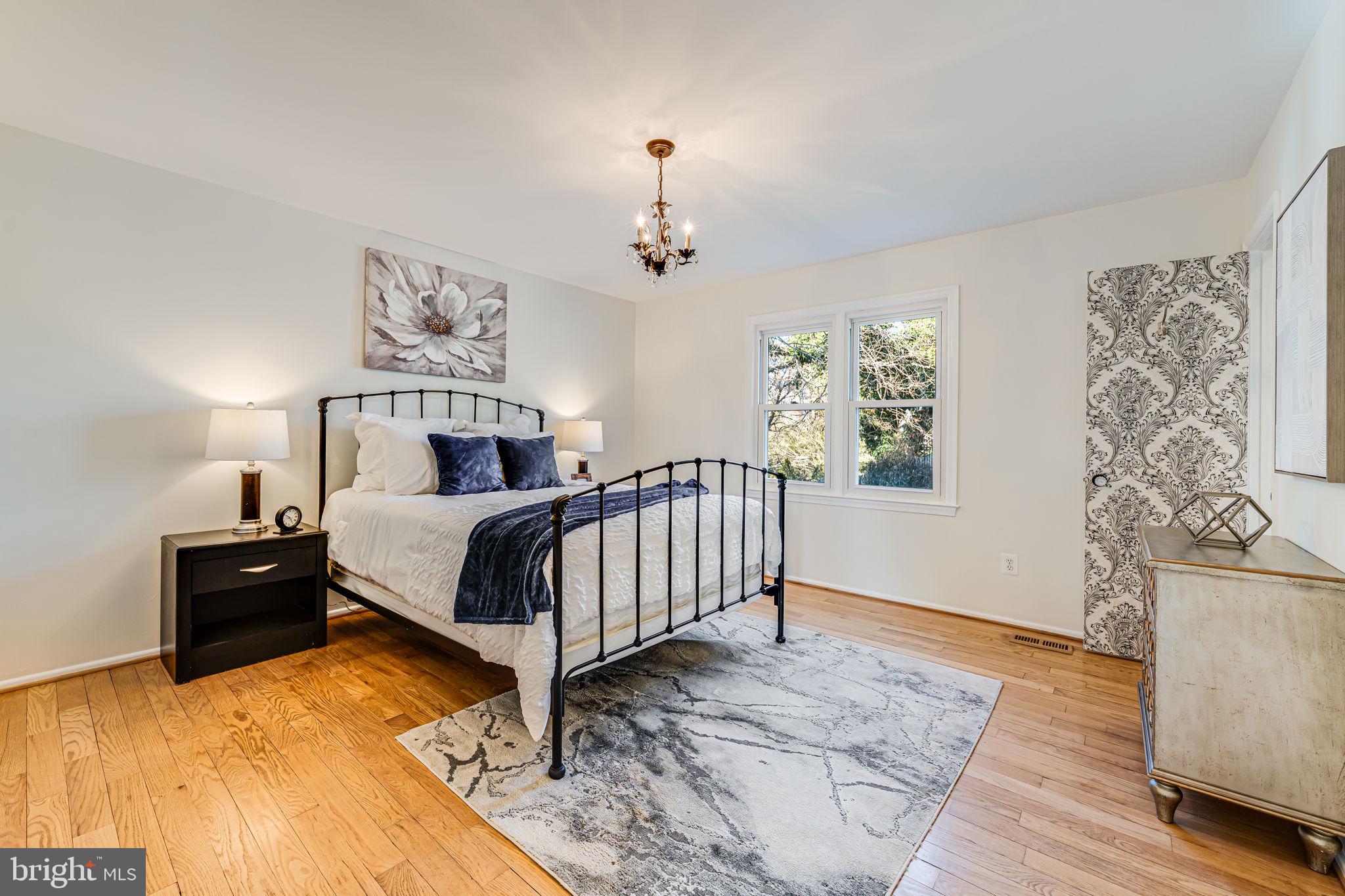1831 Quartet Circle Vienna, VA 22182 - Photo 28 of 60 a bedroom with a bed and a table in it