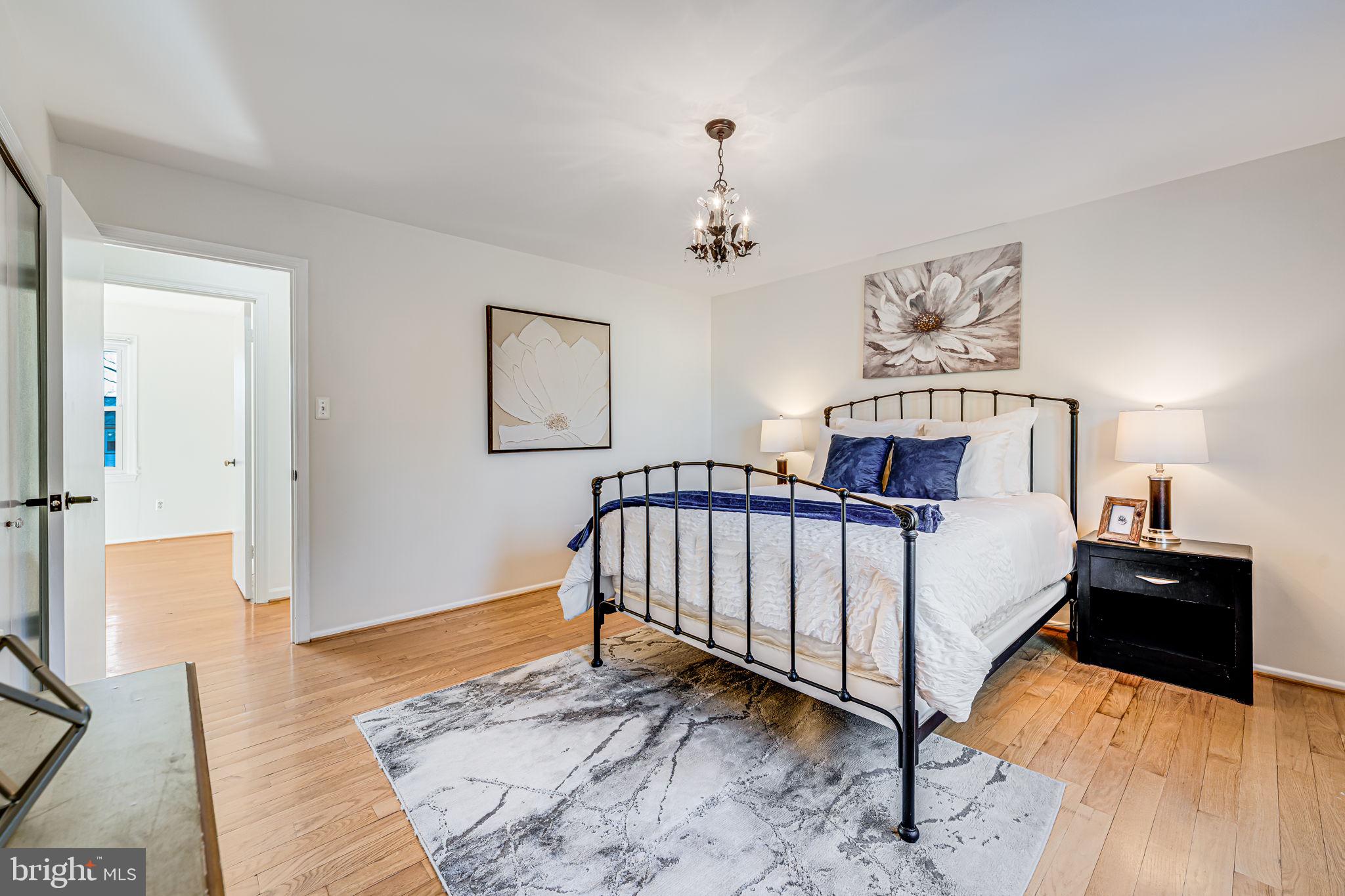 1831 Quartet Circle Vienna, VA 22182 - Photo 29 of 60 a bedroom with a bed and wooden floor
