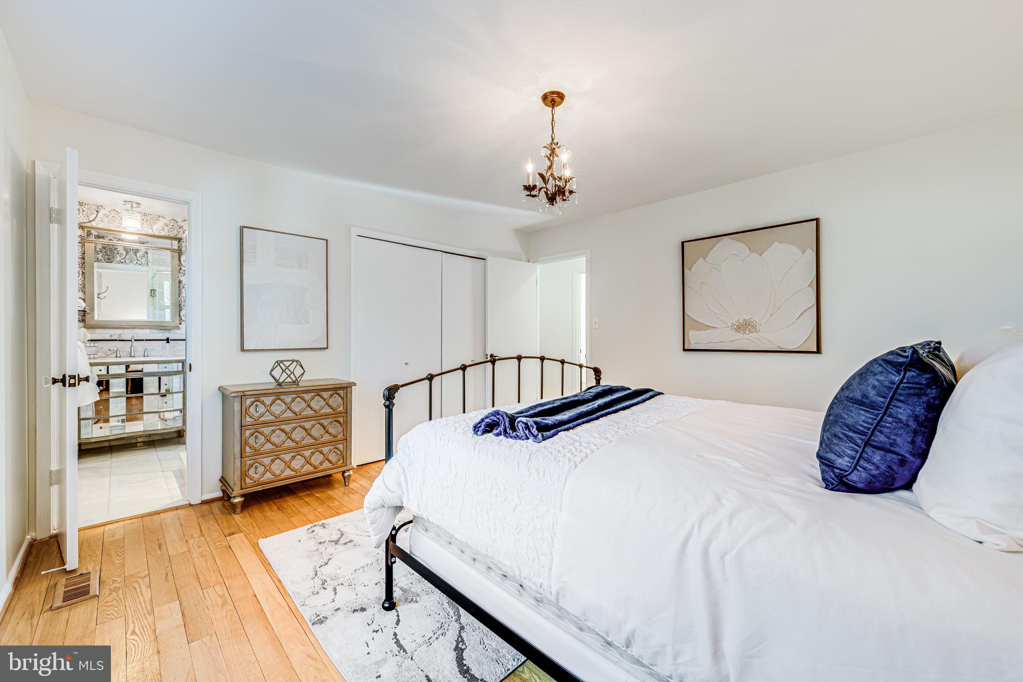 1831 Quartet Circle Vienna, VA 22182 - Photo 30 of 60 a bedroom with a bed and wooden floor