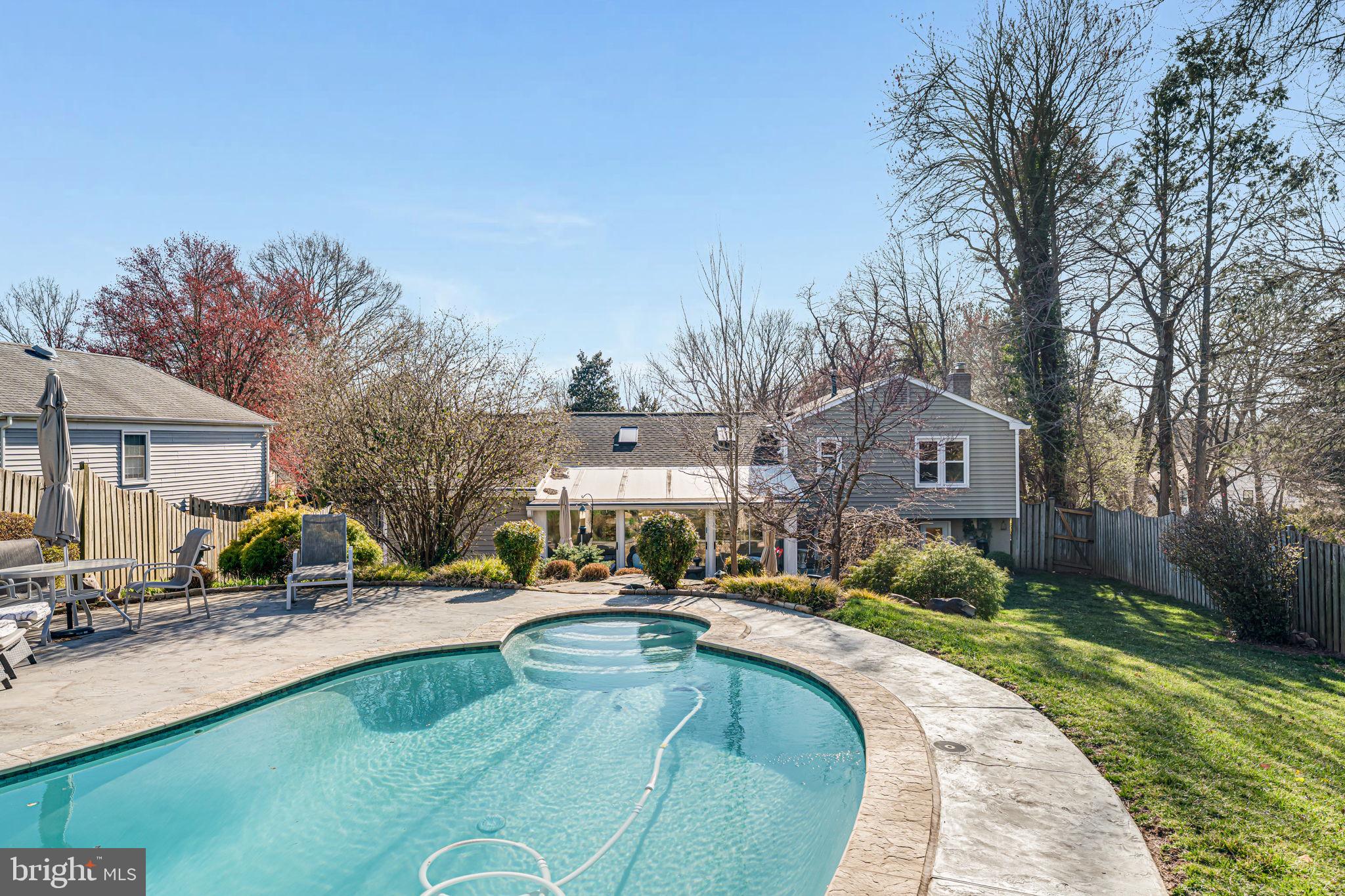 1831 Quartet Circle Vienna, VA 22182 - Photo 4 of 60 a swimming pool with outdoor seating and yard
