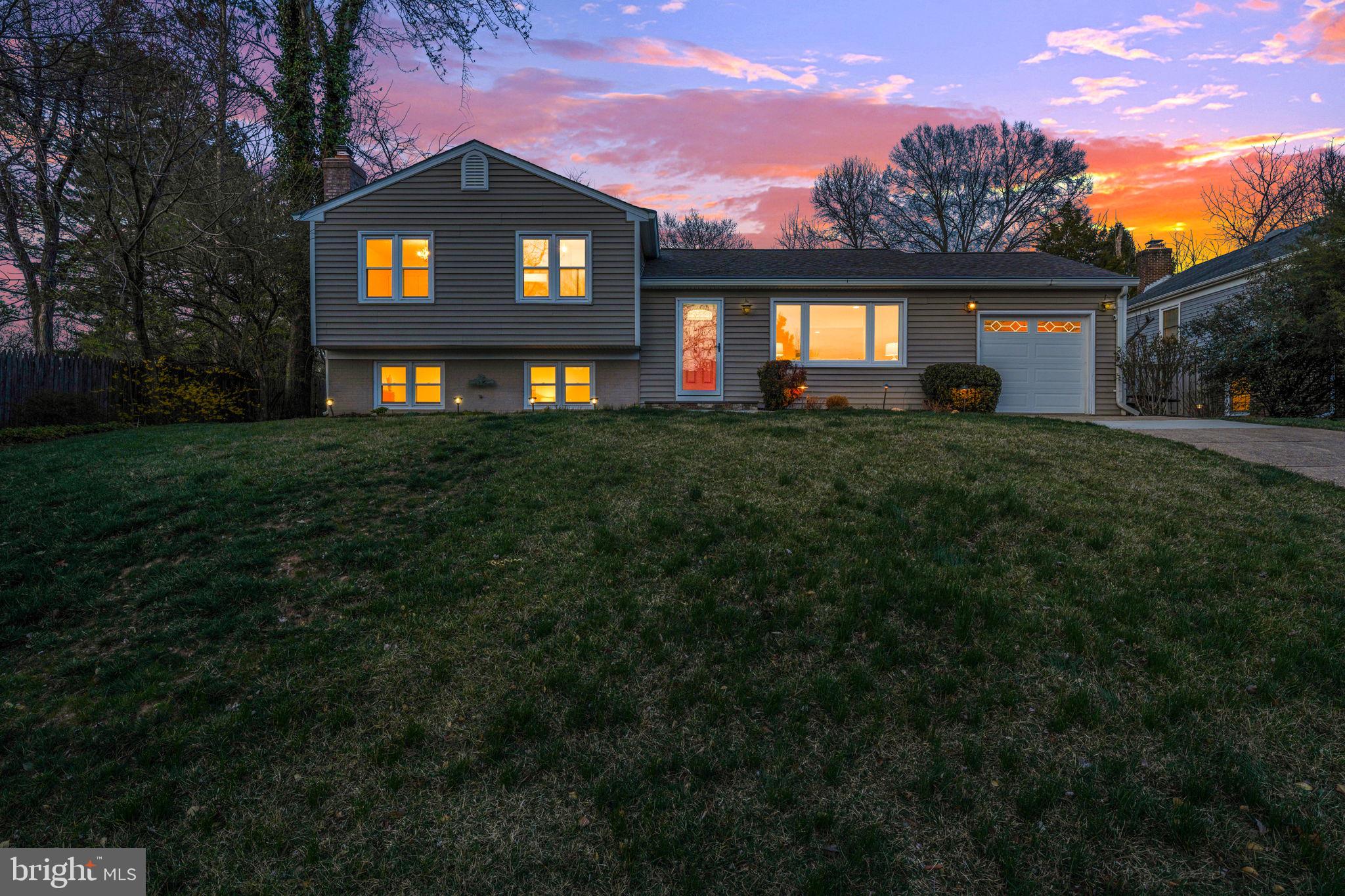 1831 Quartet Circle Vienna, VA 22182 - Photo 46 of 60 a front view of a house with a yard and garage