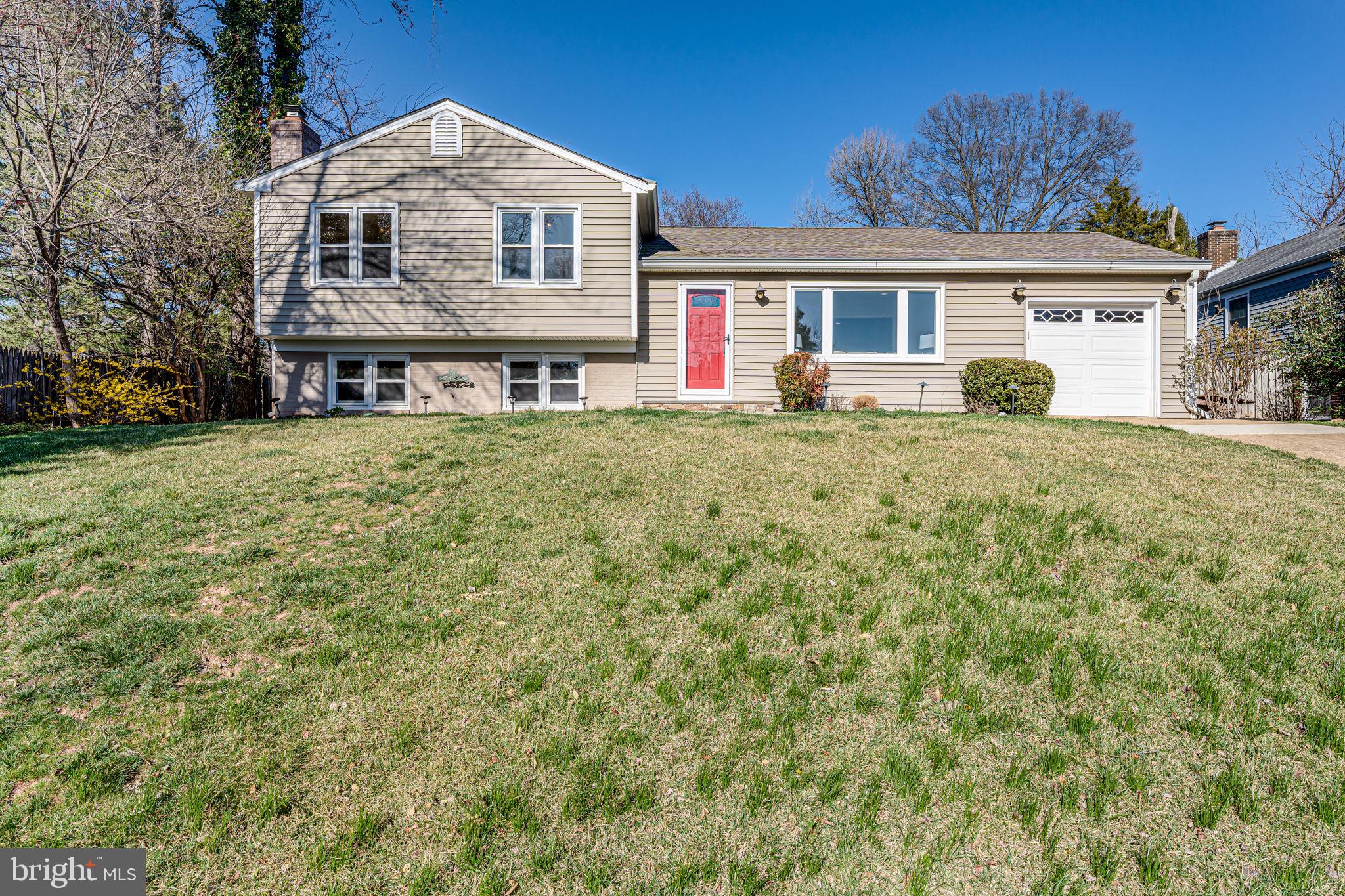 1831 Quartet Circle Vienna, VA 22182 - Photo 55 of 60 a front view of a house with a yard