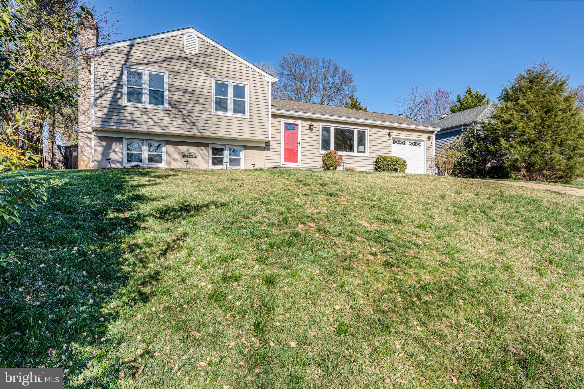 1831 Quartet Circle Vienna, VA 22182 - Photo 56 of 60 a front view of a house with a garden